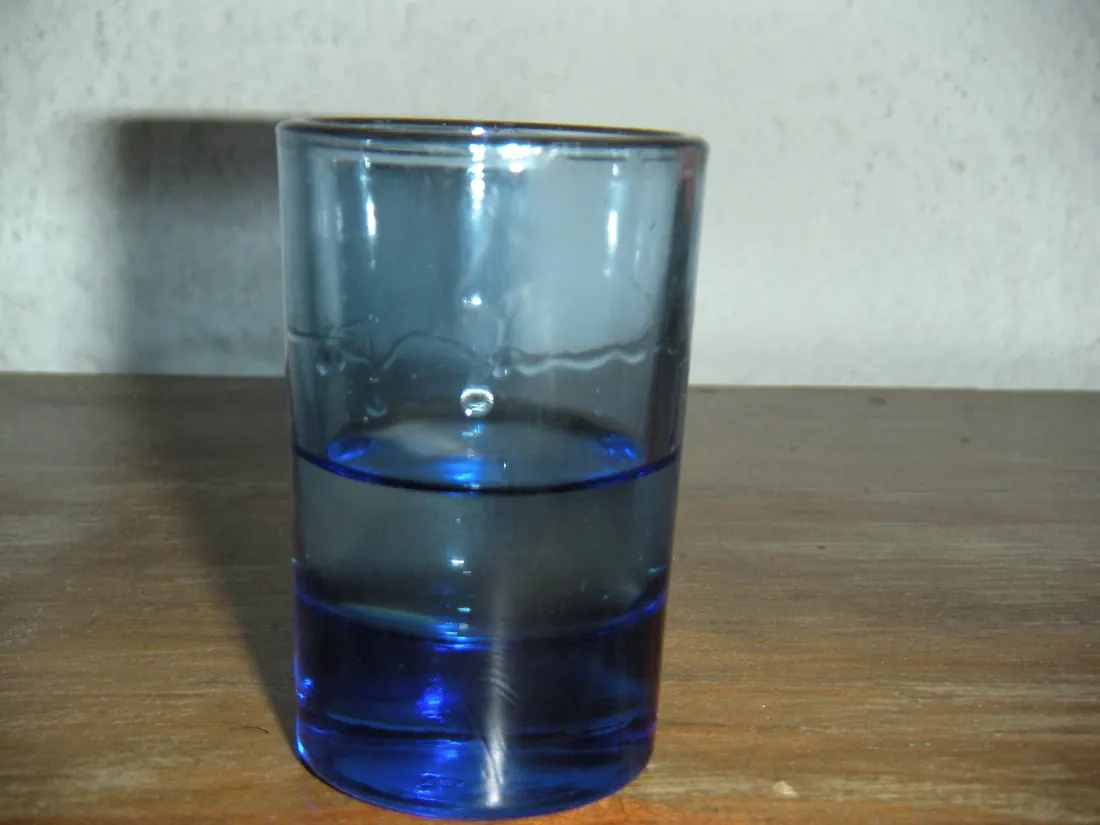 A traditional clay copita cup of mezcal